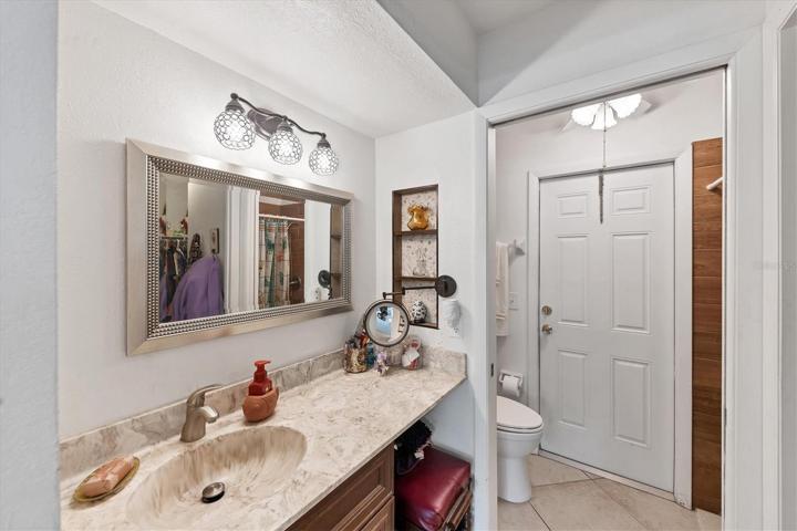 en suite, rear door leads out directly to pool