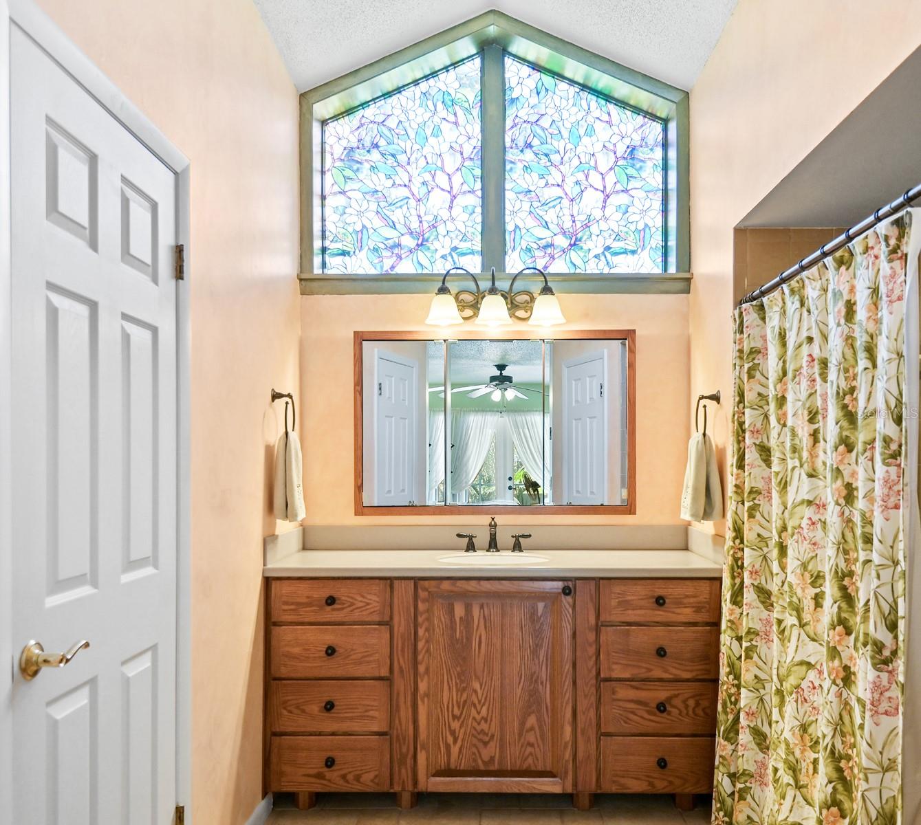 Plenty of natural lighting in here! Spacious step-in shower.
