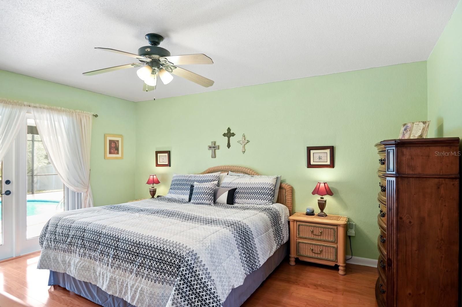 Main bedroom with new insulated double doors leading out to lanai/pool.