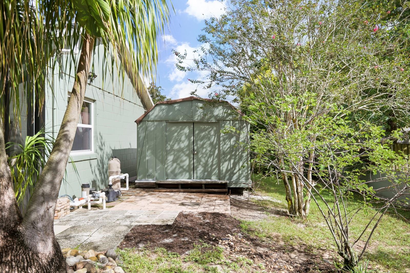 Shed is perfect for additional storage and lawn equipment.