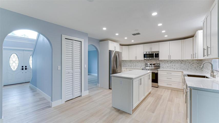 Recessed lighting and arched doorways