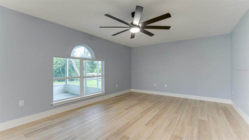 Great Room with views to wooded and green back yard