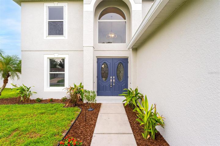 Newly landscaped entry with pathway lighting