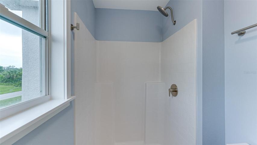 Primary shower and toilet in separate enclosed space