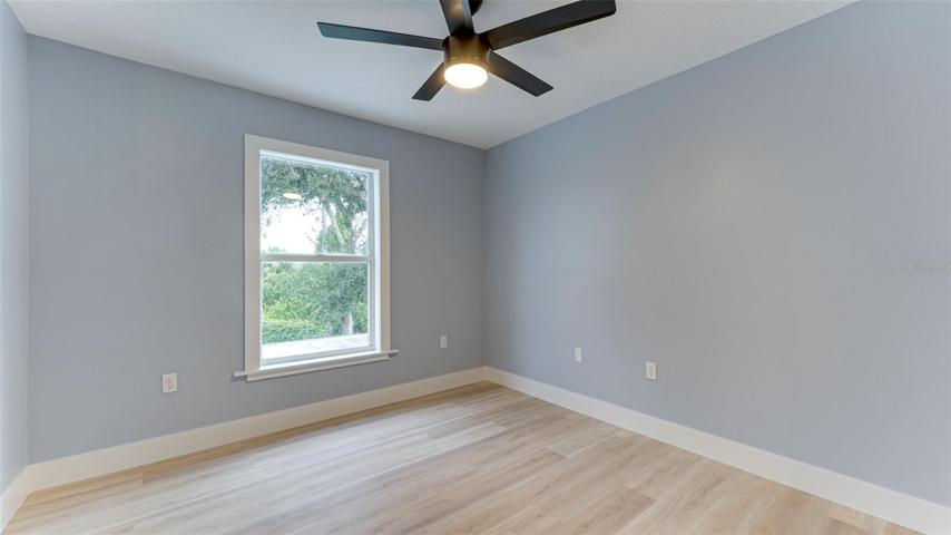Second bedroom with beautiful green views of back yard