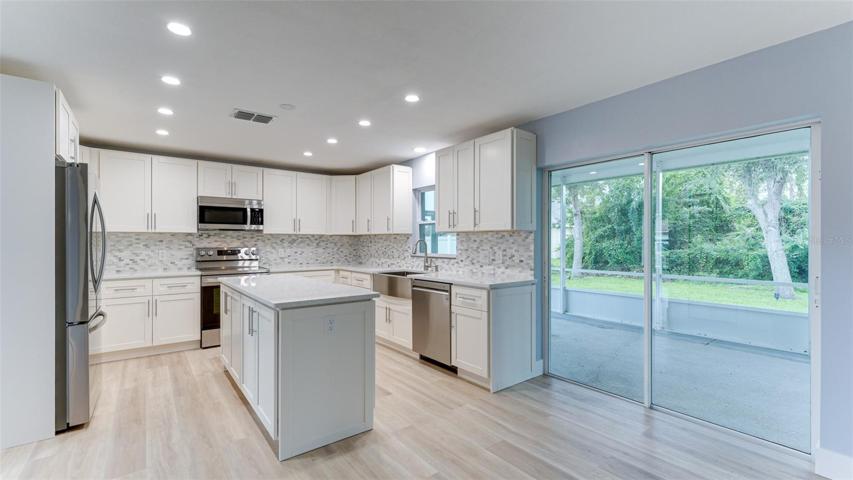 Sliding door to huge screened porch from kitchen and great room