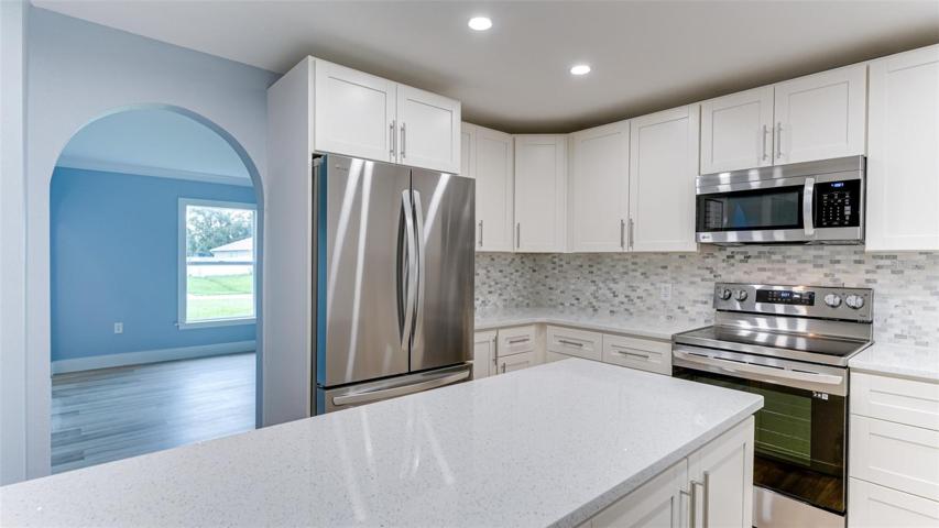 Quartz countertops, Wood Cabinets, LG appliances