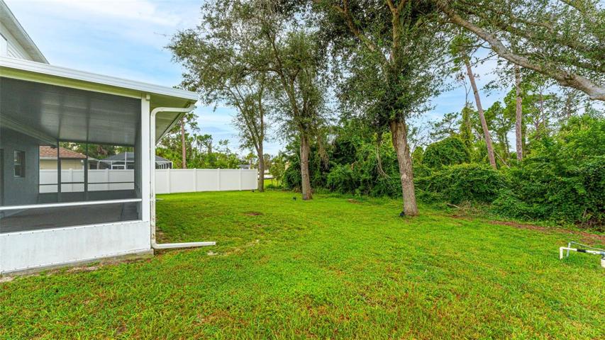 View of back yard and screened porch