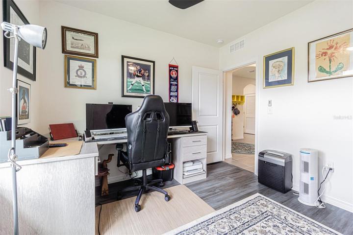 Secondary Bedroom with desk.