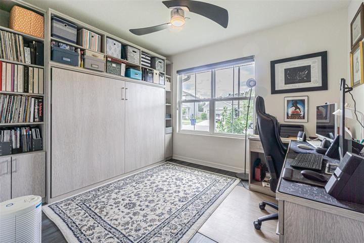 Secondary Bedroom with Murphy bed and desk.