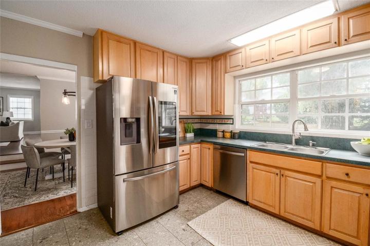 Large bright kitchen with stainless steel appliances