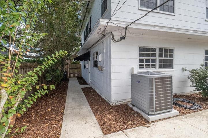 side access to garage, back yard & new AC