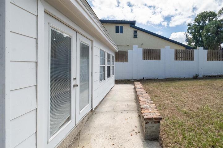 French doors from den/bonus room to back yard