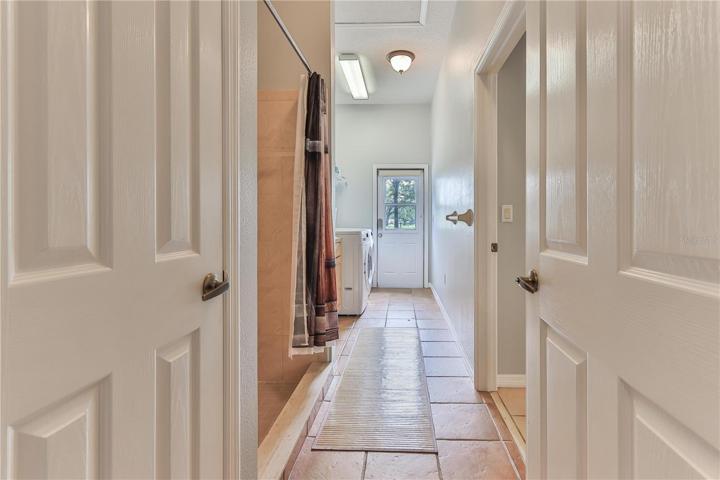 Door to outside from laundry room/shower