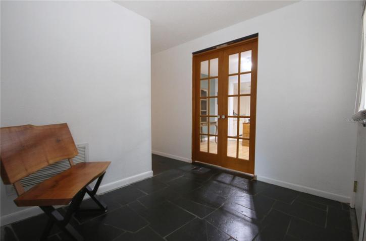 Front Foyer with Slate - showing entry to Dining Room (currently being used as a home office)