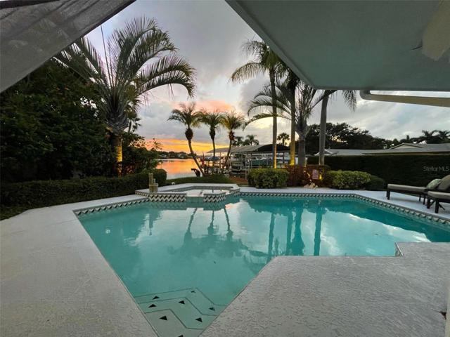 Pool with Stunning Sunset and Water Views