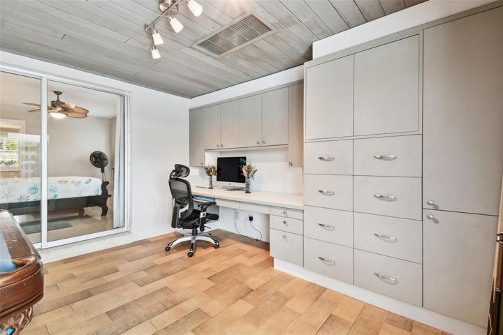 Family Room w/Built-in shelving leading to guest suite