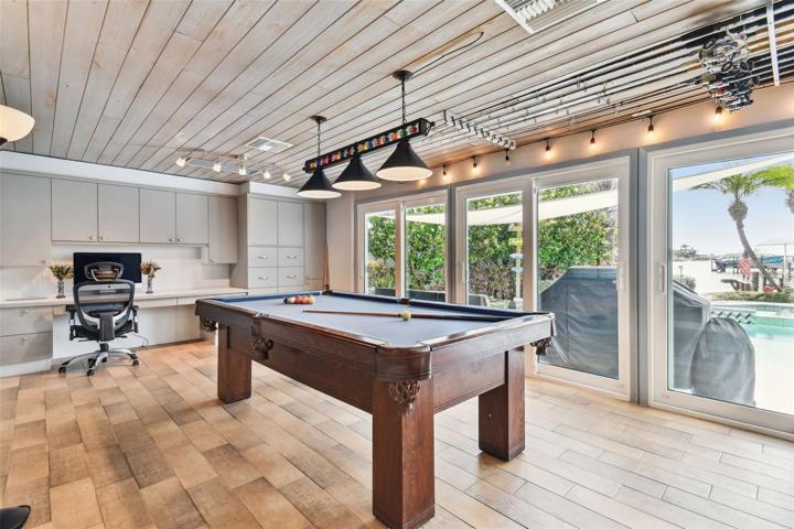 Billiard Table in Family Room w/Sliders to Pool & Water Views