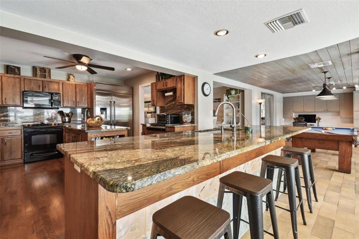 Family Room Double-Sided Counter w/Bar Stools Facing Kitchen