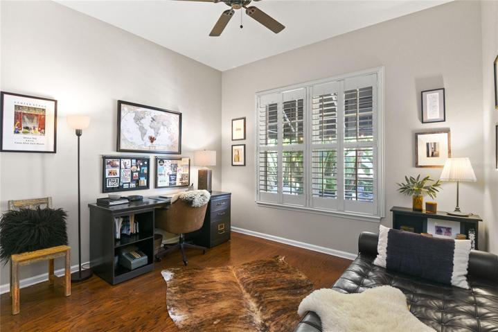Downstairs bedroom with custom closet and patio/pool view