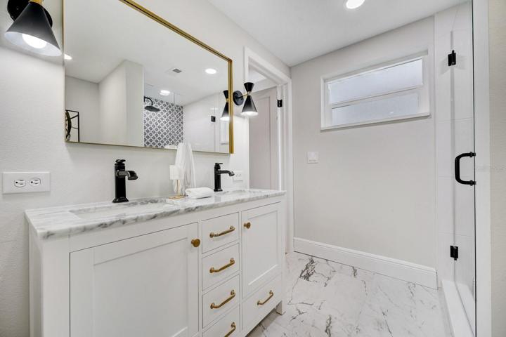 Owner's bathroom with double sink vanity.