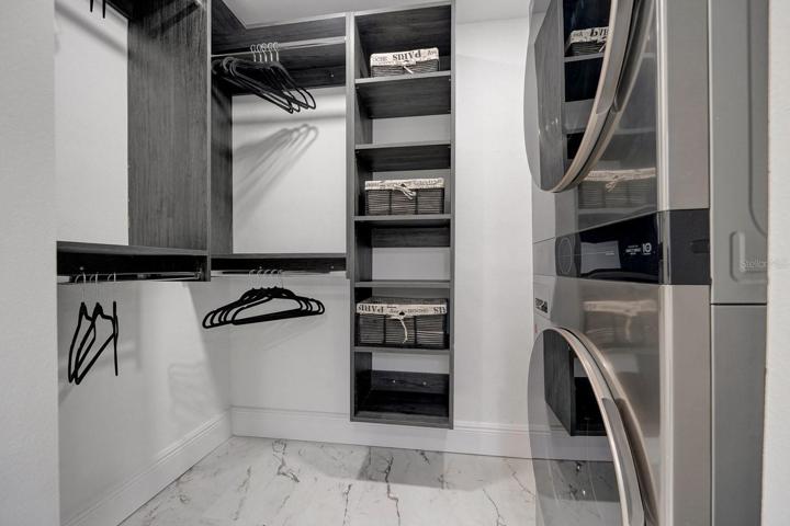Owner's walk-in closet and laundry room.