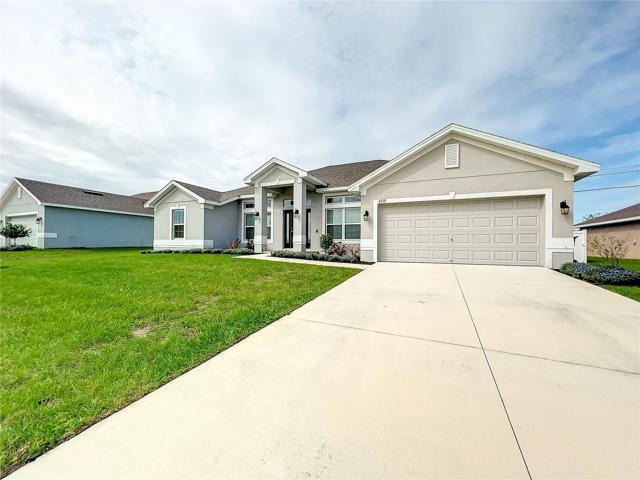 Front View of Home with Long Driveway