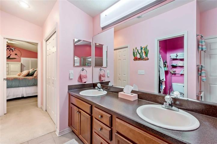 Master retreat has double vanity, step-in tile oversized shower, and separate tub.