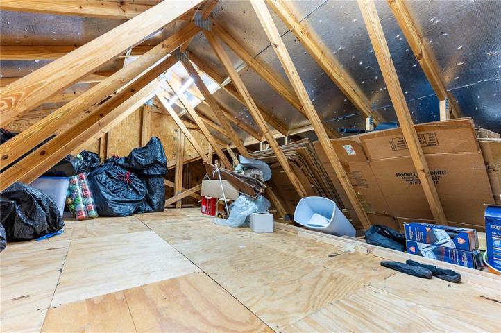 Garage attic has large finish area with additional storage.