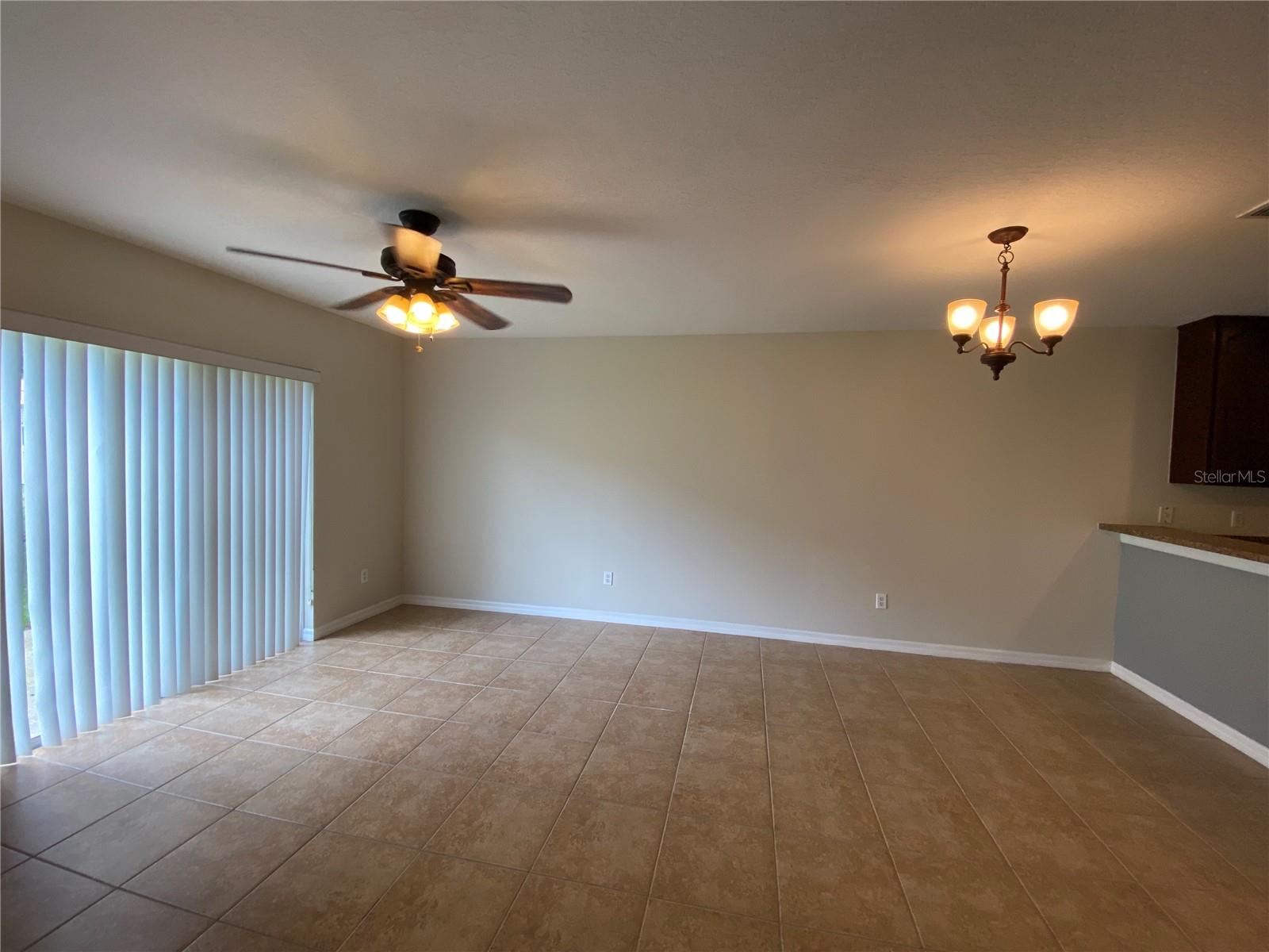 Living and Dining Areas with Sliding Glass Door