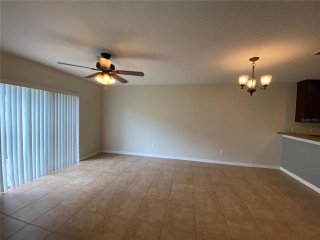 Living and Dining Areas with Sliding Glass Door