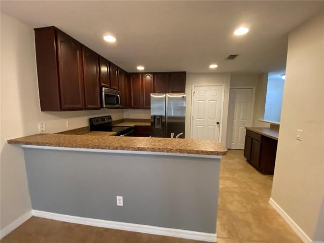 Kitchen with Breakfast Bar and Desk Area
