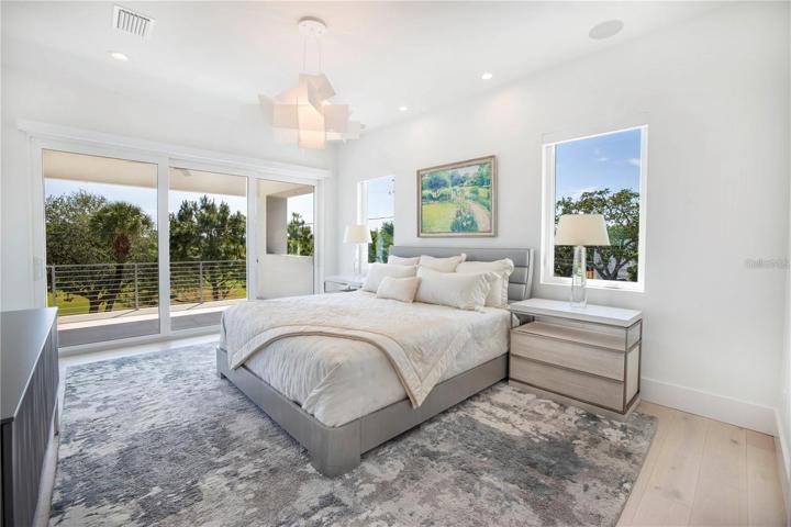 PRIMARY BEDROOM WITH ITS OWN PRIVATE COVERED BALCONY