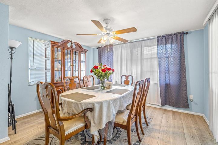 This additional space is being used as a dining room. Could also be an additional family area or home office.