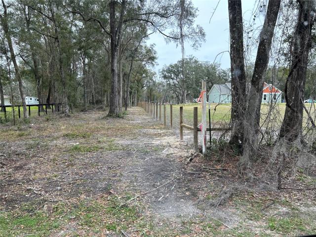 Entrance from NW 160th which is paved