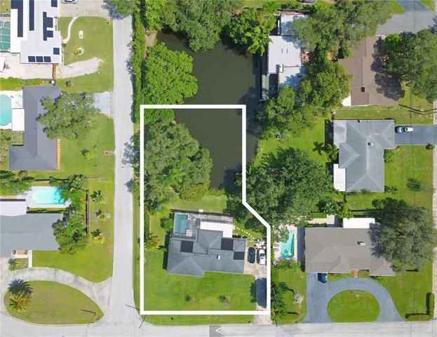 Welcome to this beautiful 2BR/2BA home that sits on a large corner lot in a quiet neighborhood in Clearwater. This home features almost 1/2 acre of land and offers a stunning view of Lake Estelle. Approx lot size, verify with county records and property appraiser's report.