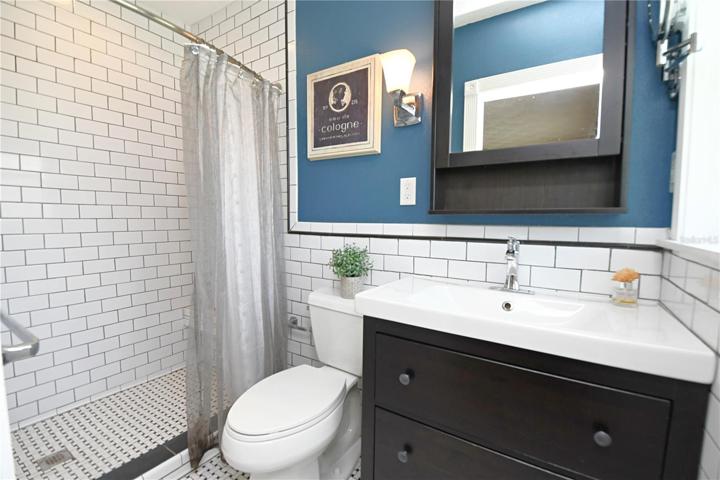 The en-suite bathroom has been beautifully remodeled and includes a walk-in shower, adding a touch of luxury to your daily routine.