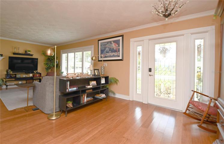 Step into the welcoming entryway and immediately be captivated by the open view of the family room.