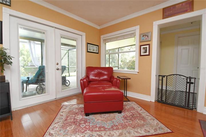 The living room area offers versatility, providing ample space for a seating area, creating a cozy spot to read books or relax.