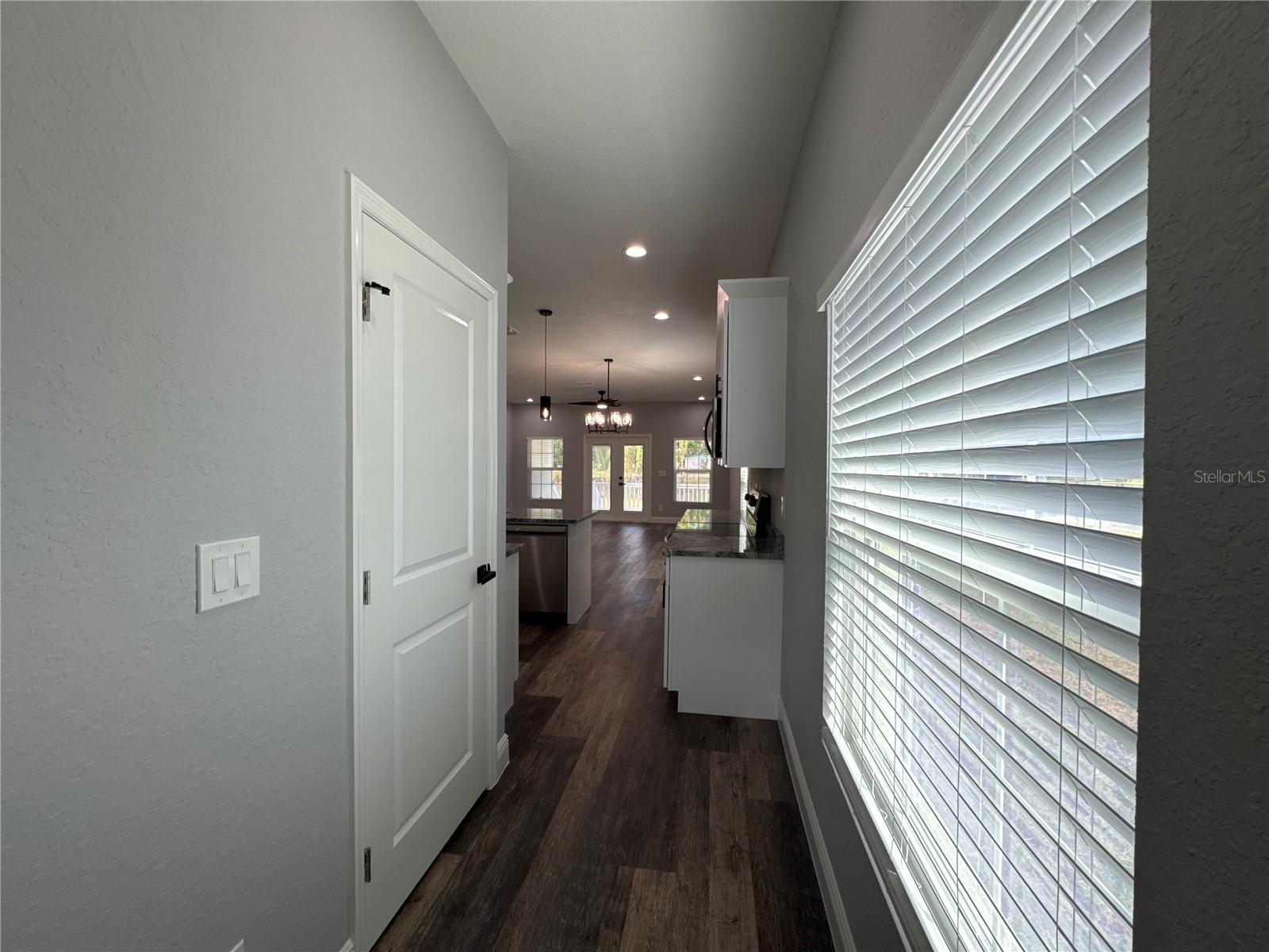 Entryway from Formal Dining Room to Kitchen (Walk-In Pantry on Left)