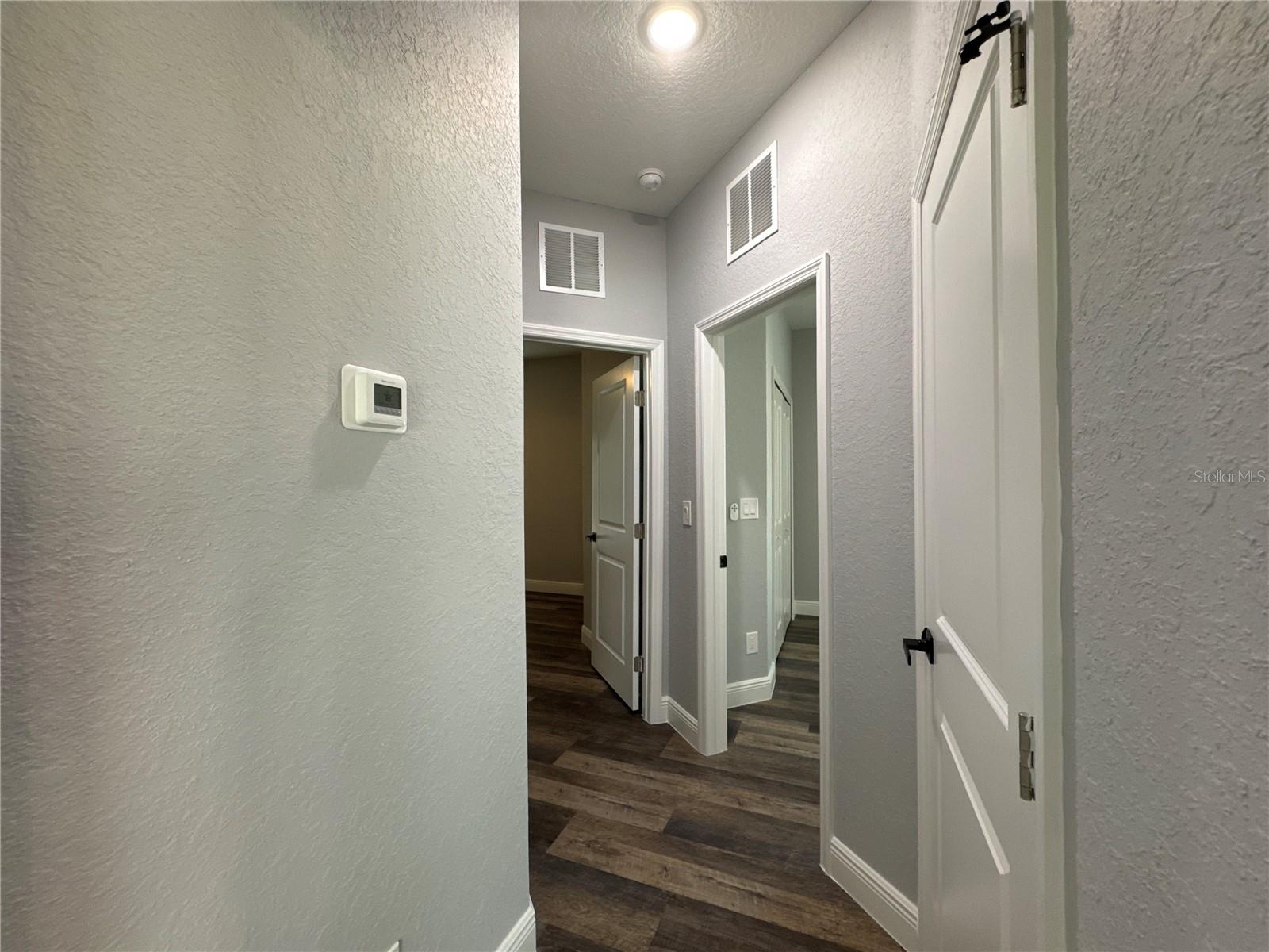 Hallway to Bedroom 2 &amp; 3, Bathroom 2, Laundry Room