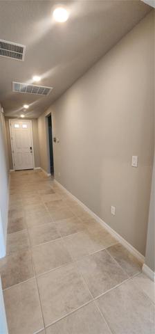 Hallway leading to bedrooms 2 & 3 and the exit