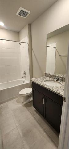 Bathroom 2 with bathtub & granite countertop