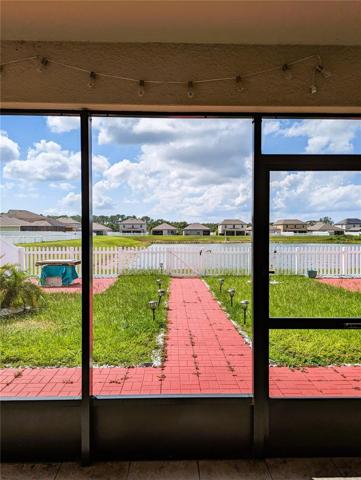 beautifully pavers backyard and pond view