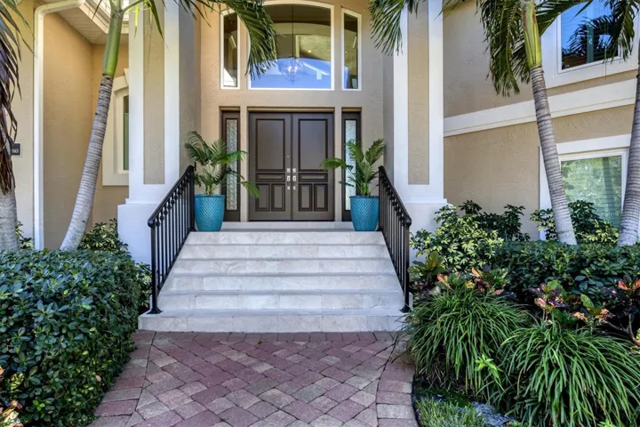 Raised lot above required base flood elevation with shell stone entry