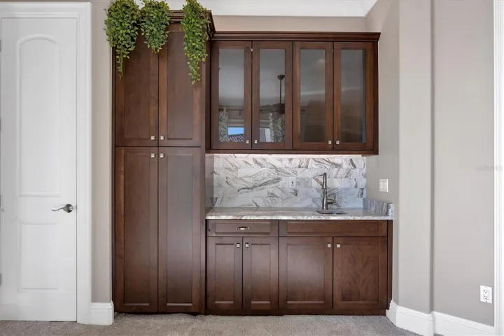 Full cabinets and closet by wet bar