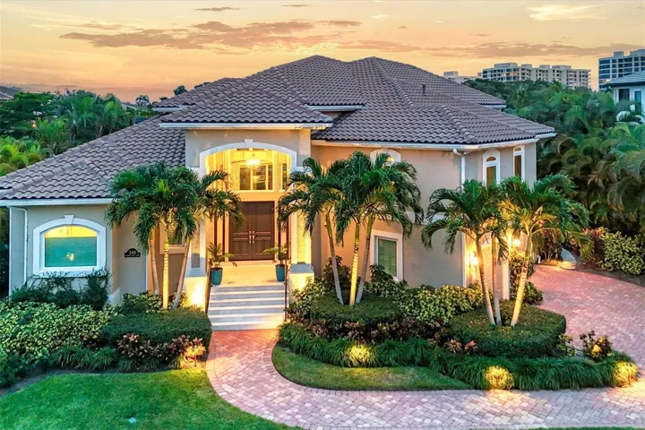 Generous landscape lighting graces the lot
