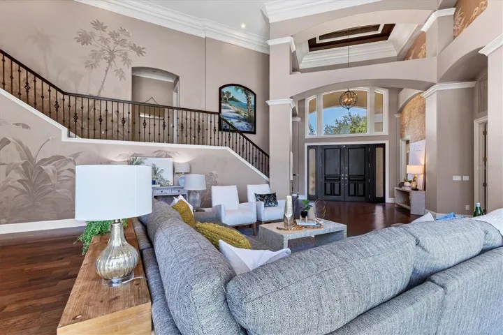 Graceful staircase leads to bedrooms on 2nd and 3rd floor