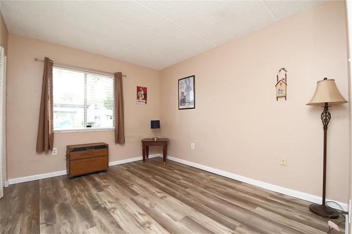 Bedroom #2 has been upgraded with new luxury vinyl flooring, adding a touch of modern elegance to the space.