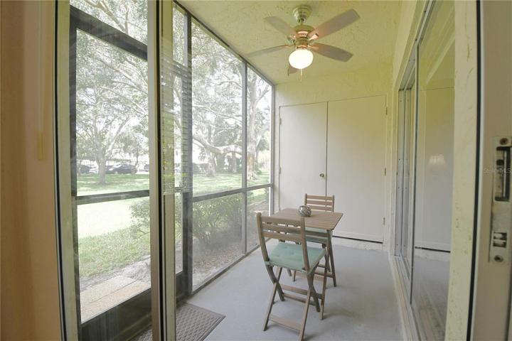 Master bedroom offers a private access to the screened-in balcony.